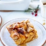 eggnog bread pudding, eggnog bread pudding recipe, Kara Lydon, easy bread pudding recipe, eggnog bread pudding in white ceramic container with holiday greenery