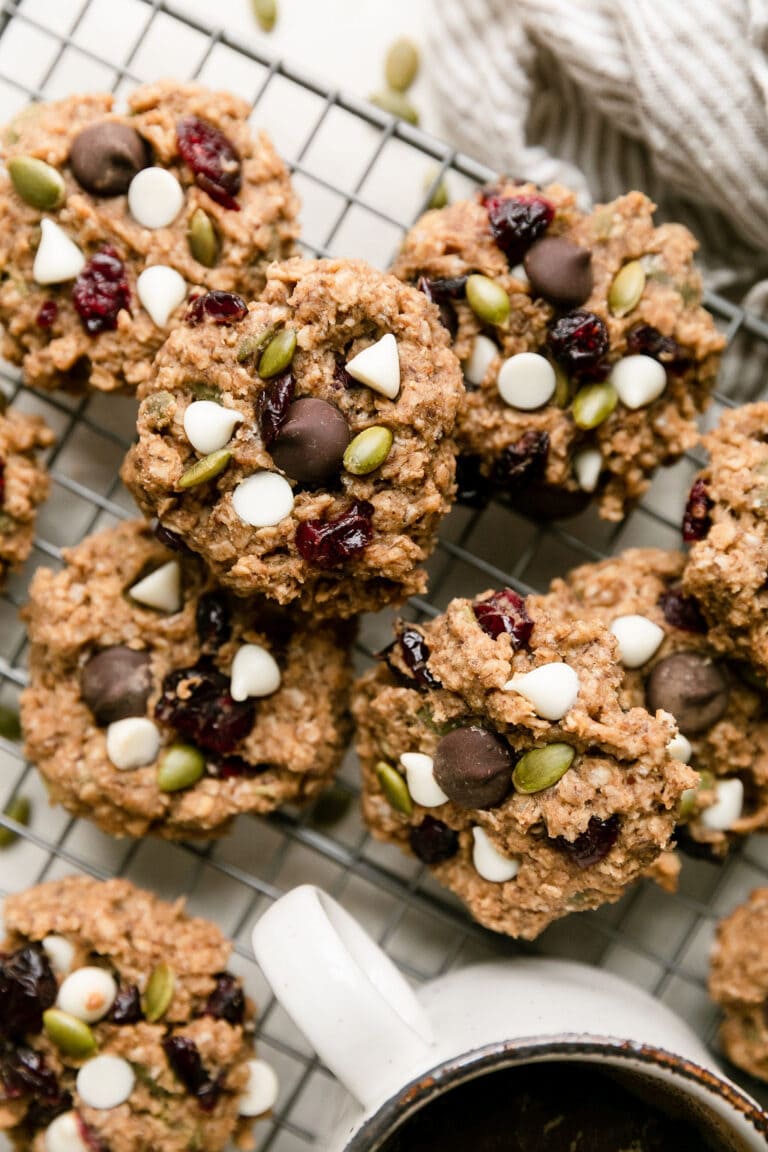 Overhead view Trail Mix Breakfast Cookies with white chocolate chips and dried cranberries on wire cooling rack.